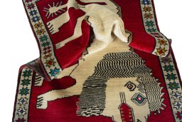 Corner detail of 2000s Persian Gabbeh rug showing border pattern and Wool pile