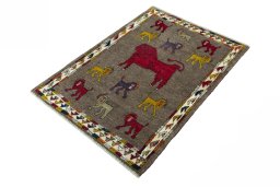 Corner detail of 2000s Persian Gabbeh rug showing border pattern and Wool pile