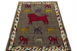 Surface texture of 2000s Persian Gabbeh rug with natural Wool and intricate pattern