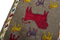 Backside of handmade 2000s Persian Gabbeh rug showing knot structure and weave density