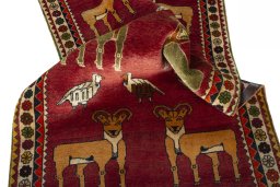 Corner detail of 2000s Persian Gabbeh rug showing border pattern and Wool pile