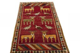 Surface texture of 2000s Persian Gabbeh rug with natural Wool and intricate pattern