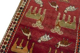 Backside of handmade 2000s Persian Gabbeh rug showing knot structure and weave density