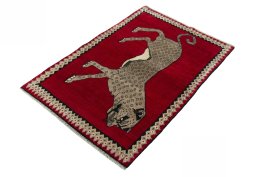 Corner detail of 2000s Persian Gabbeh rug showing border pattern and Wool pile
