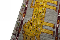 Backside of handmade New Persian Gabbeh rug showing knot structure and weave density