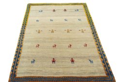 Surface texture of 2000s Persian Gabbeh rug with natural Wool and intricate pattern