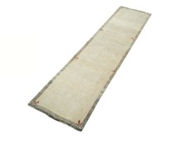 Corner detail of New Persian Gabbeh rug showing border pattern and Wool pile