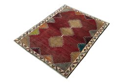 Corner detail of 2000s Persian Gabbeh rug showing border pattern and Wool pile