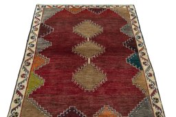 Surface texture of 2000s Persian Gabbeh rug with natural Wool and intricate pattern