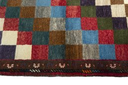 Close-up detail of 2000s Persian Gabbeh rug from Iran / Persia showing Wool weave
