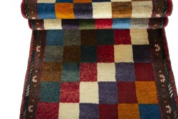 Full view of 2000s Persian Gabbeh rug from Iran / Persia, 203 × 87 cm in Multi Color tones