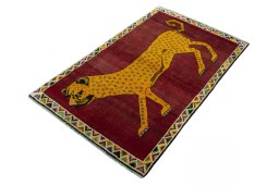 Corner detail of 2000s Persian Gabbeh rug showing border pattern and Wool pile
