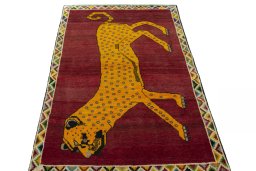 Surface texture of 2000s Persian Gabbeh rug with natural Wool and intricate pattern