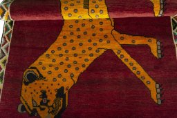 Full view of 2000s Persian Gabbeh rug from Iran / Persia, 178 × 107 cm in Red tones