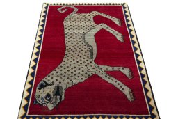 Surface texture of 2000s Persian Gabbeh rug with natural Wool and intricate pattern