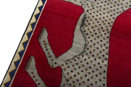 Backside of handmade 2000s Persian Gabbeh rug showing knot structure and weave density