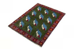 Corner detail of 2000s Persian Gabbeh rug showing border pattern and Wool pile