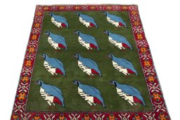 Surface texture of 2000s Persian Gabbeh rug with natural Wool and intricate pattern