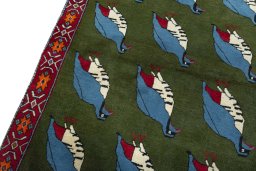 Backside of handmade 2000s Persian Gabbeh rug showing knot structure and weave density