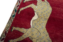 Backside of handmade 2000s Persian Gabbeh rug showing knot structure and weave density