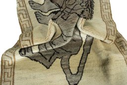 Corner detail of 2000s Persian Gabbeh rug showing border pattern and Wool pile