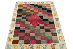 Surface texture of 2000s Persian Gabbeh rug with natural Wool and intricate pattern