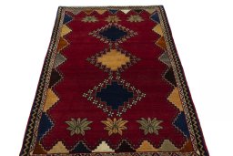 Surface texture of 2000s Persian Gabbeh rug with natural Wool and intricate pattern