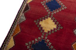 Backside of handmade 2000s Persian Gabbeh rug showing knot structure and weave density