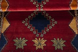 Full view of 2000s Persian Gabbeh rug from Iran / Persia, 182 × 112 cm in Red tones
