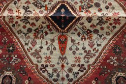 Corner detail of 2000s Persian Gabbeh rug showing border pattern and Wool pile