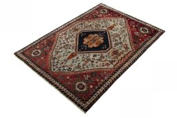Corner detail of 2000s Persian Gabbeh rug showing border pattern and Wool pile