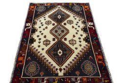 Surface texture of 2000s Persian Gabbeh rug with natural Wool and intricate pattern