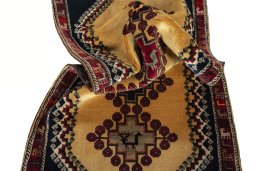 Corner detail of 2000s Persian Gabbeh rug showing border pattern and Wool pile