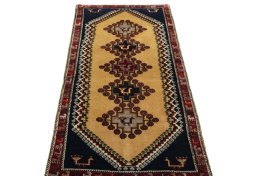 Surface texture of 2000s Persian Gabbeh rug with natural Wool and intricate pattern