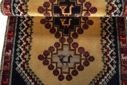 Full view of 2000s Persian Gabbeh rug from Iran / Persia, 200 × 92 cm in Yellow tones