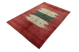 Corner detail of 2000s Persian Gabbeh rug showing border pattern and Wool pile