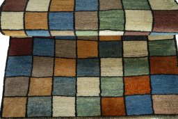 Full view of 2000s Persian Gabbeh rug from Iran / Persia, 119 × 80 cm in Multi Color tones