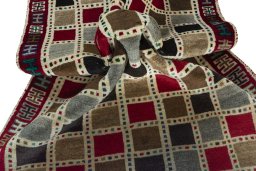 Corner detail of 2000s Persian Gabbeh rug showing border pattern and Wool pile