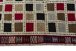 Close-up detail of 2000s Persian Gabbeh rug from Iran / Persia showing Wool weave