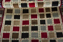 Full view of 2000s Persian Gabbeh rug from Iran / Persia, 176 × 107 cm in Multi Color tones