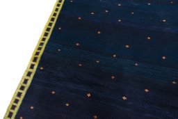 Backside of handmade 2000s Persian Gabbeh rug showing knot structure and weave density