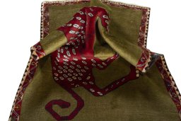 Corner detail of 2000s Persian Gabbeh rug showing border pattern and Wool pile