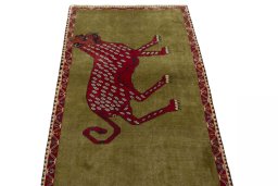 Surface texture of 2000s Persian Gabbeh rug with natural Wool and intricate pattern