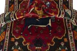 Corner detail of 2000s Persian Gabbeh rug showing border pattern and Wool pile
