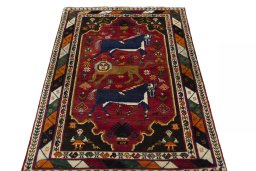 Surface texture of 2000s Persian Gabbeh rug with natural Wool and intricate pattern