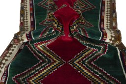 Corner detail of 2000s Persian Gabbeh rug showing border pattern and Wool pile