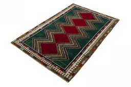 Corner detail of 2000s Persian Gabbeh rug showing border pattern and Wool pile