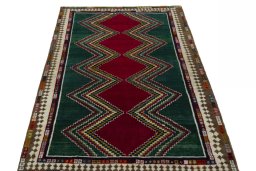 Surface texture of 2000s Persian Gabbeh rug with natural Wool and intricate pattern