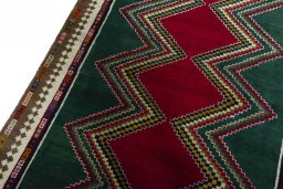 Backside of handmade 2000s Persian Gabbeh rug showing knot structure and weave density