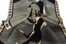 Corner detail of 2000s Persian Gabbeh rug showing border pattern and Wool pile